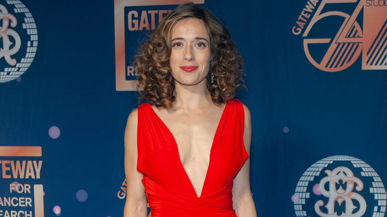 Marina Squerciati in red jumpsuit