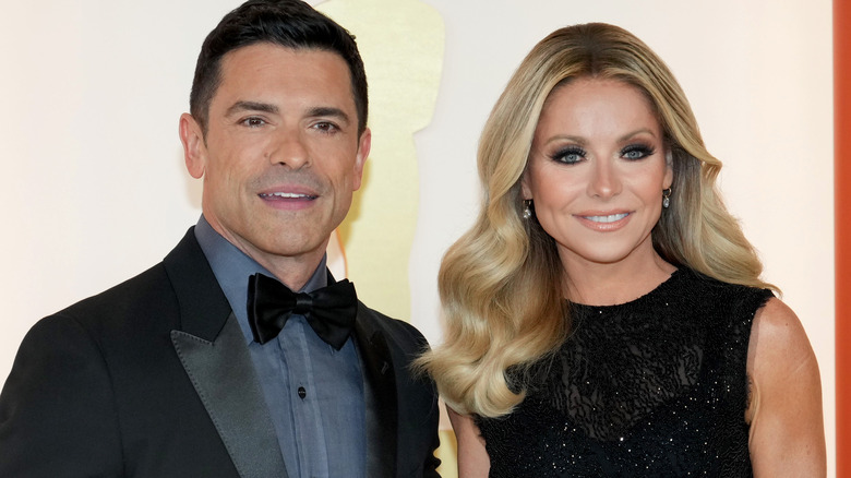 Mark Consuelos with Kelly Ripa posing