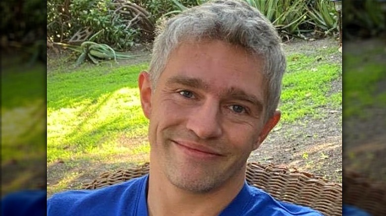Matt Brown sitting outdoors