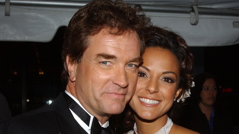 John Callahan and Eva Larue posing cheek-to-cheek
