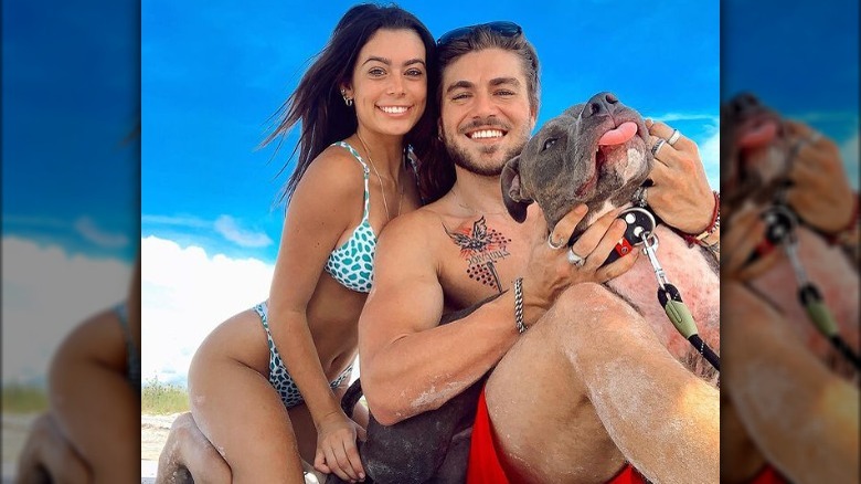 Sami, Gus, and their dog at the beach