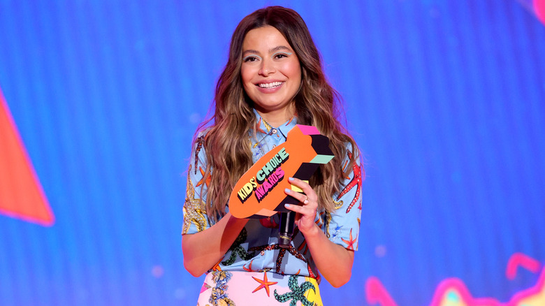 In this image released on March 13, Miranda Cosgrove speaks onstage during Nickelodeon's Kids' Choice Awards