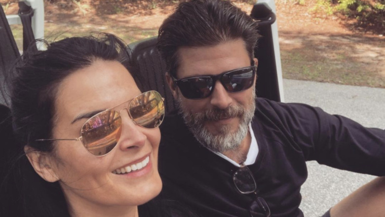 Angie Harmon and Greg Vaughan smiling 