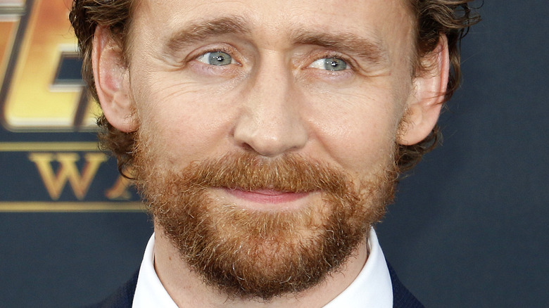 Tom Hiddleston bearded and smiling 