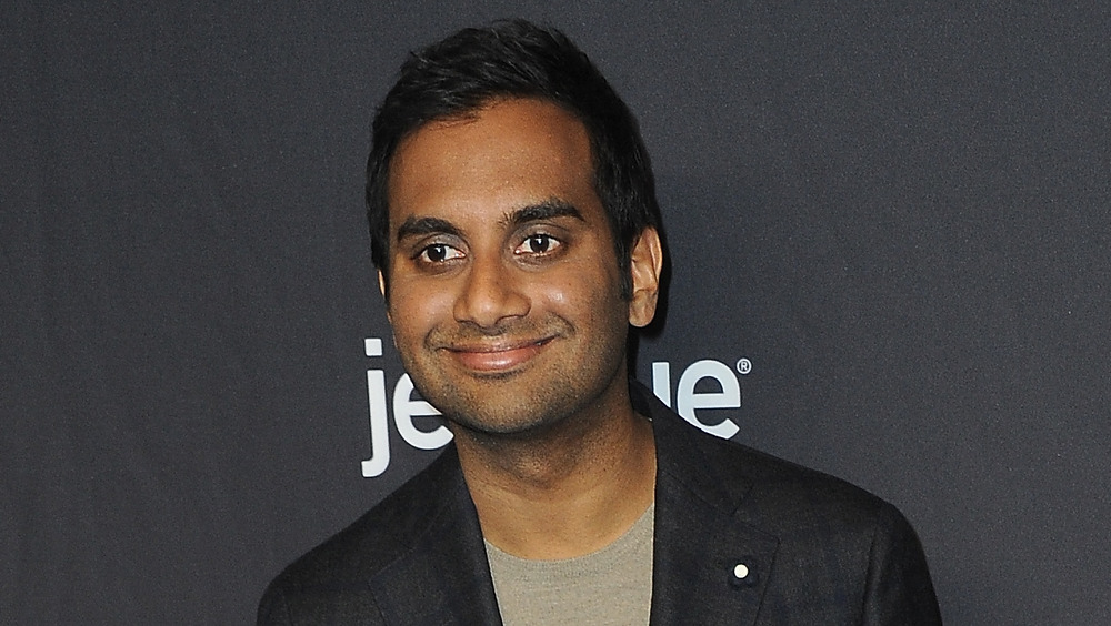 Aziz Ansari smiling 