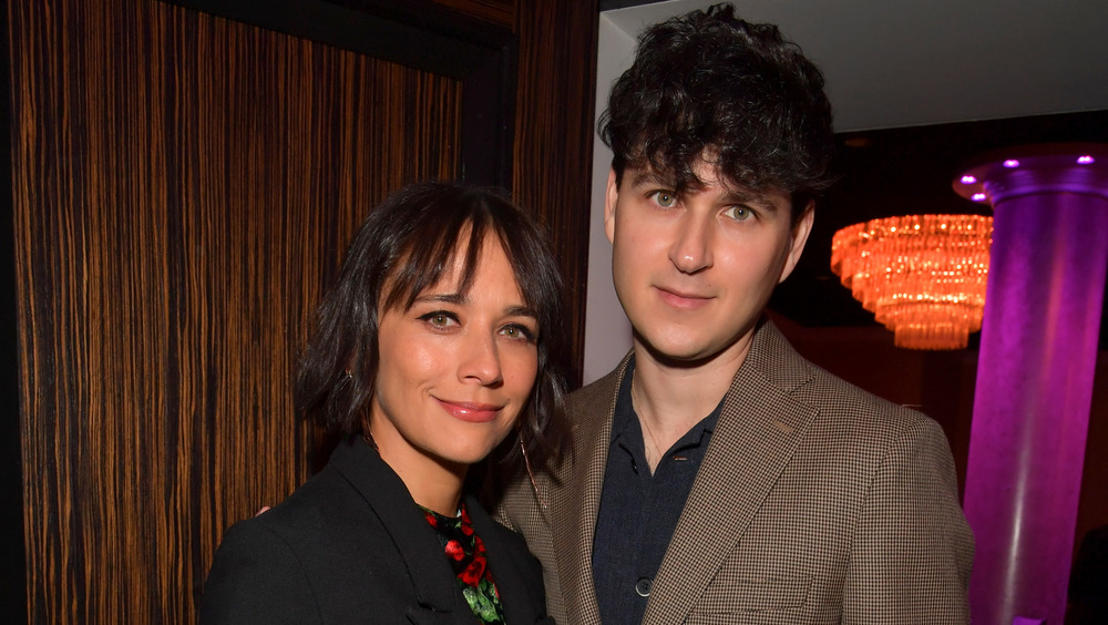 Rashida Jones and Ezra Koenig standing close together 
