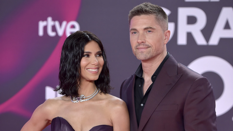 Roselyn Sánchez looking at Eric Winter