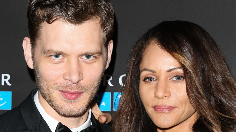 Joseph Morgan and Persia White posing