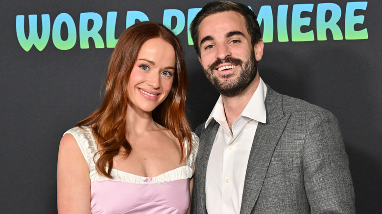 Whitney Leavitt and Conner Leavitt pose on the red carpet