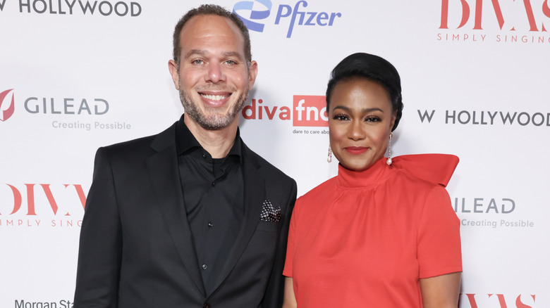 Tatyana Ali and husband Dr Vaughn Rasberry at a red carpet event