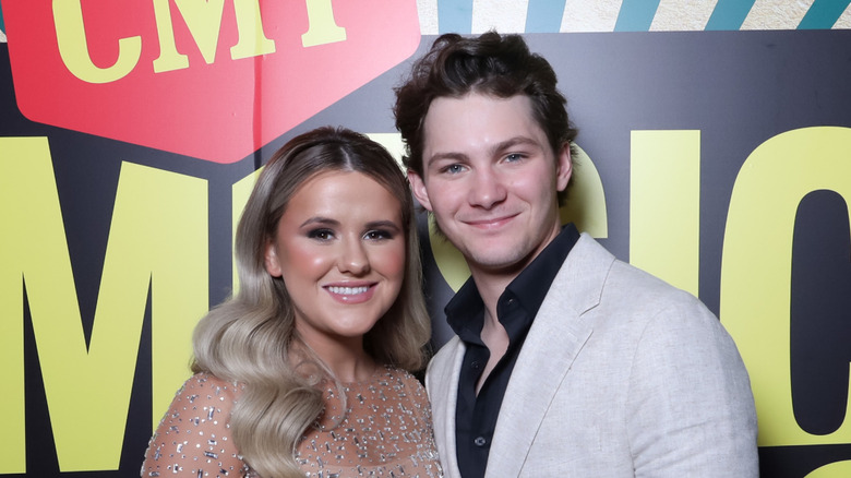 Jenna Weeks and Montana Jordan posing on the red carpet at the CMT Awards