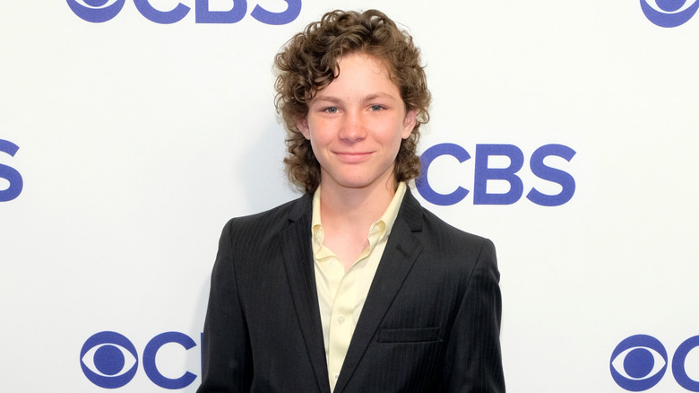 Montana Jordan posing in front of a CBS logo