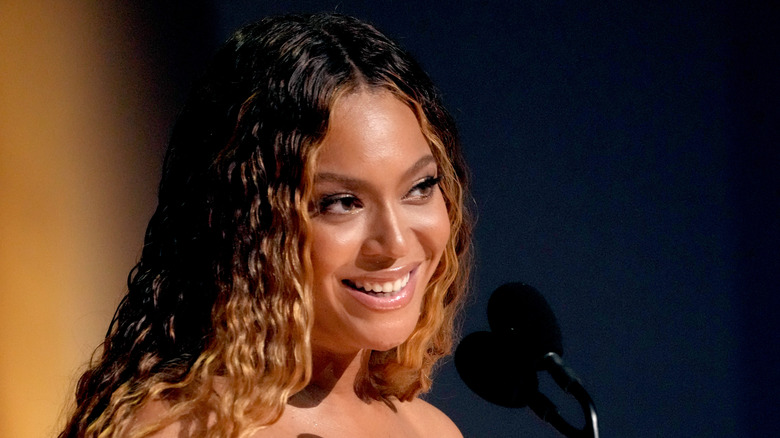 Beyonce smiling with mic