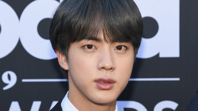 Jin of BTS, not smiling, 2019 award show red carpet