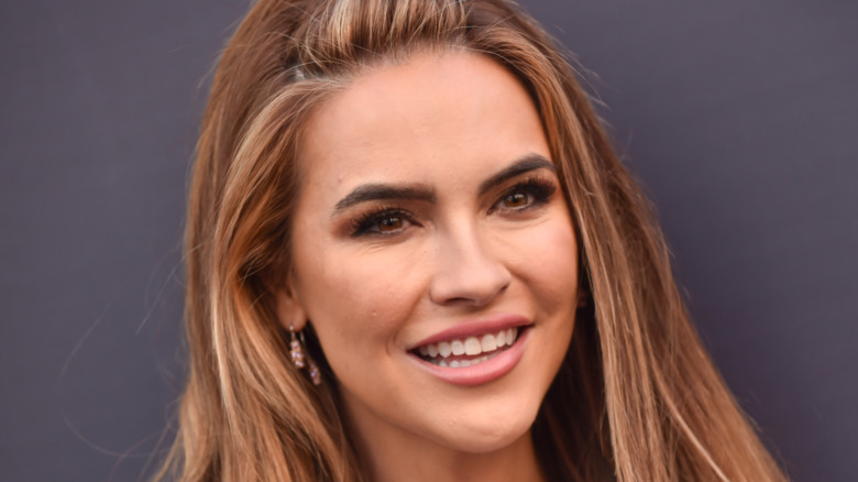 Chrishell Stause smiling at a red carpet event