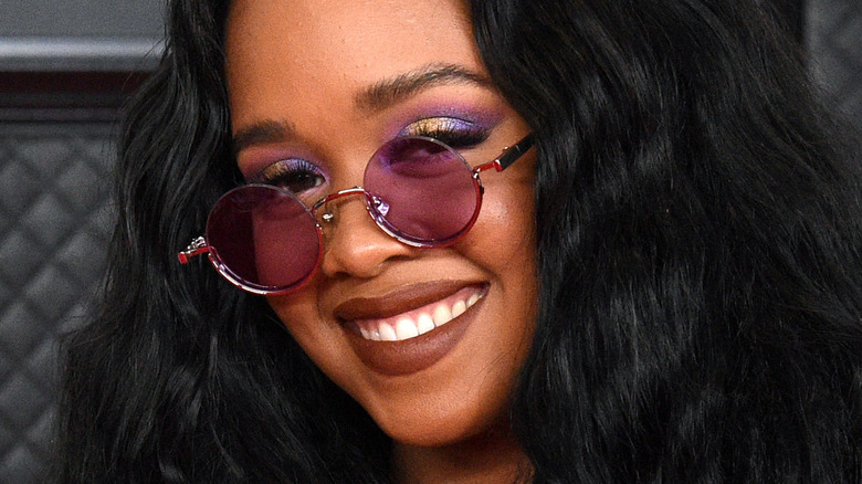 H.E.R. smiling