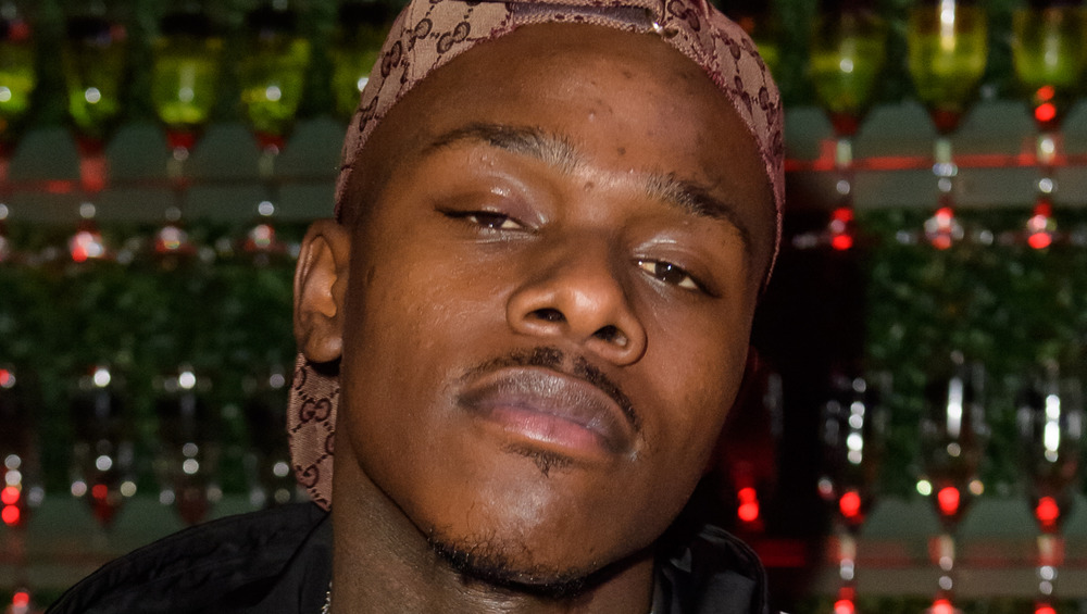 DaBaby posing at an event 