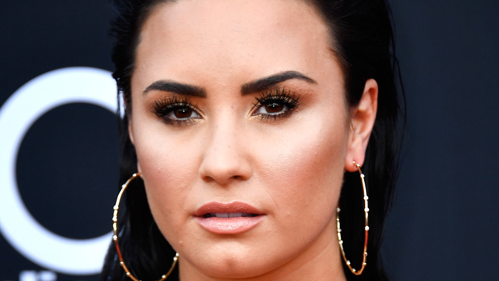 Demi Lovato staring at camera