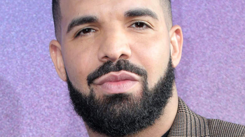 drake with beard purses lips