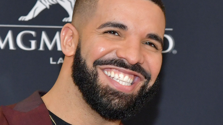 Drake slightly smiling