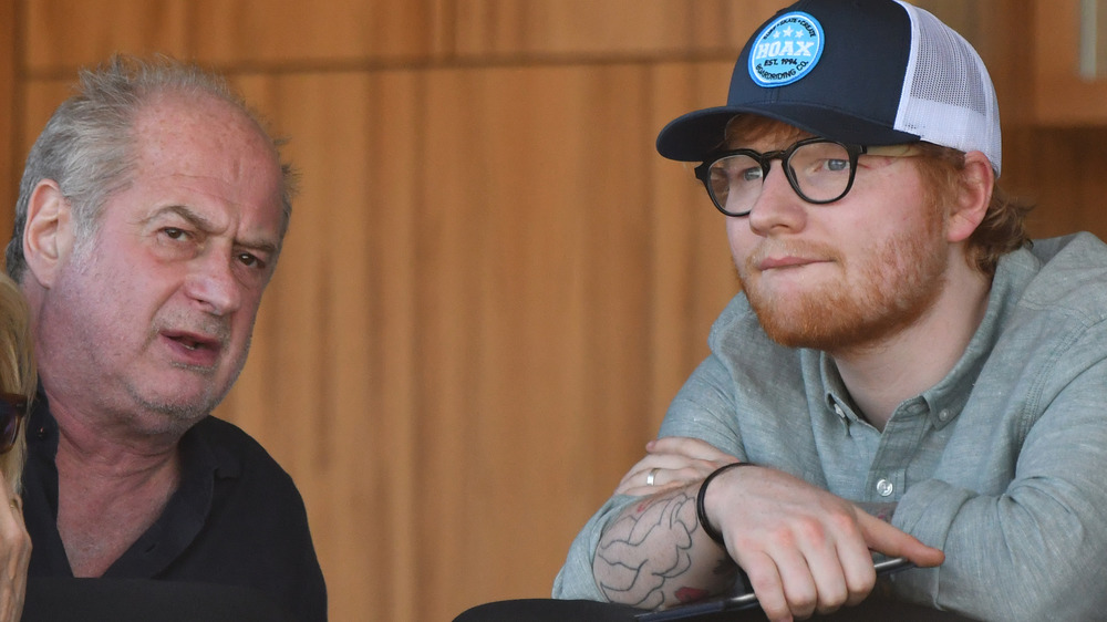 Ed Sheeran and Michael Gudinski sitting together