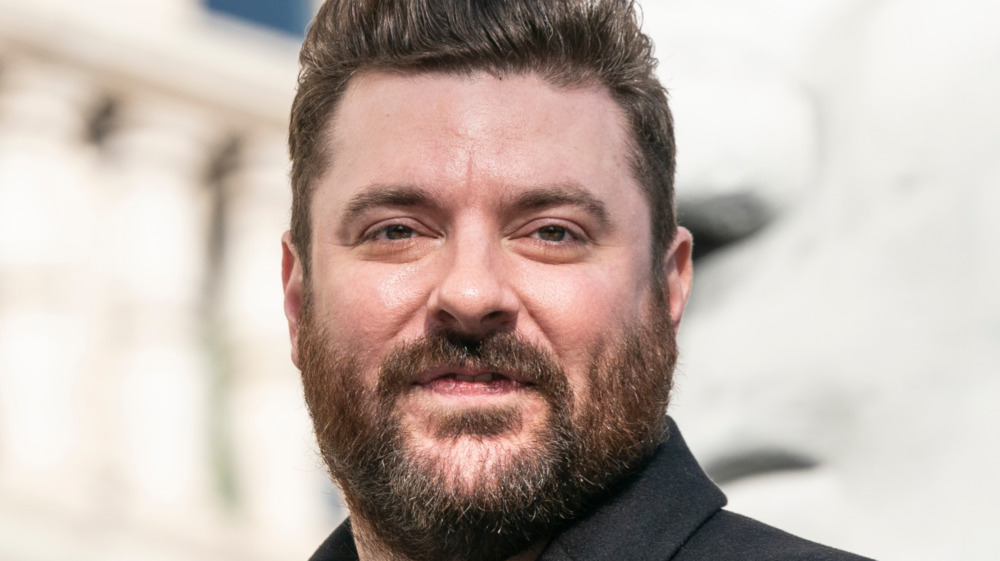 Chris Young gives a slight grin at a public event in 2019