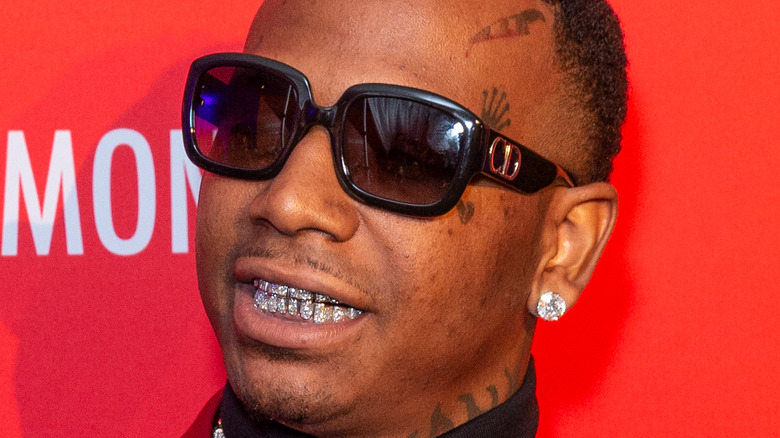 Moneybagg Yo smiling in sunglasses