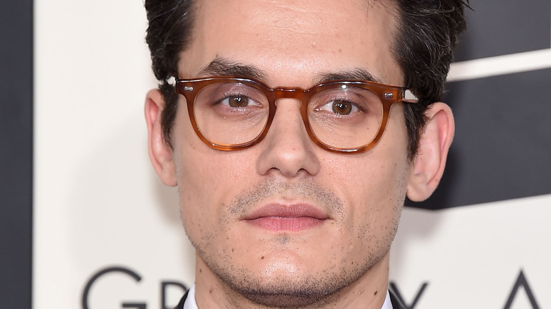 John Mayer smiles on the red carpet