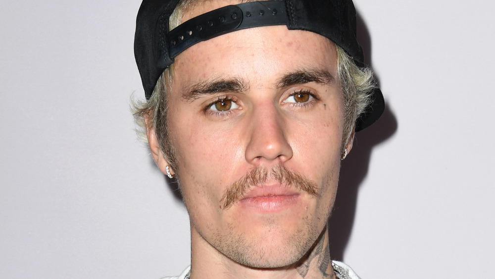 Bieber backwards cap and mustache