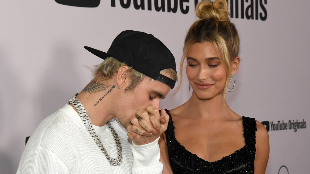 Justin kissing Hailey's hand