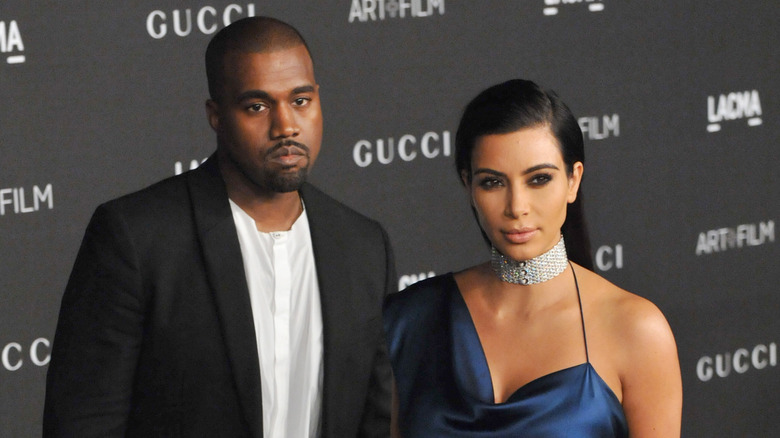 Kanye West and Kim Kardashian posing