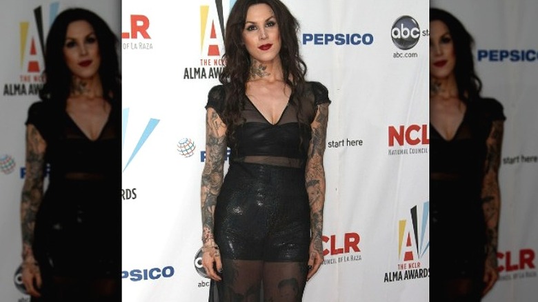 Kat Von D sheer dress, showing off Oliver Peck thigh tattoo
