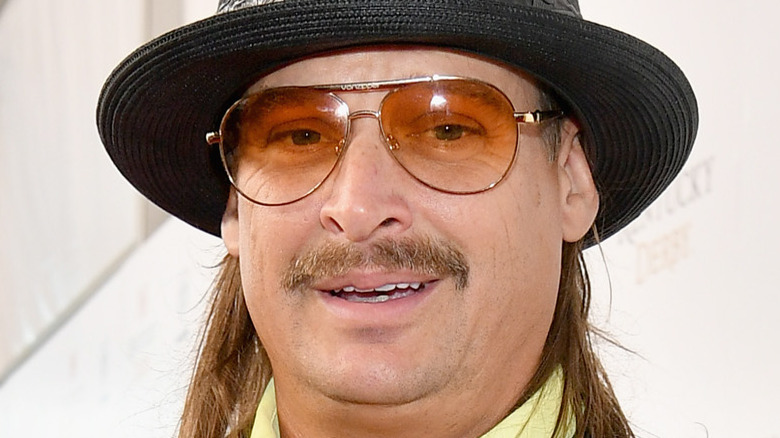 Kid Rock posing in hat and sunglasses