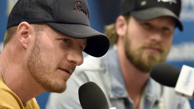 Tyler Hubbard and Brian Kelley staring