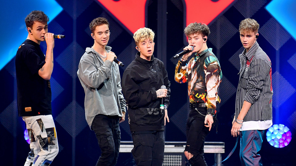 The members of the band Why Don't We onstage