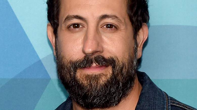 Old Dominion lead singer,  Matthew Ramsey, smirking, 2020 red carpet, facial hair, jean jacket