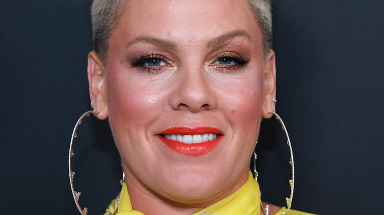 Pink wearing long earrings