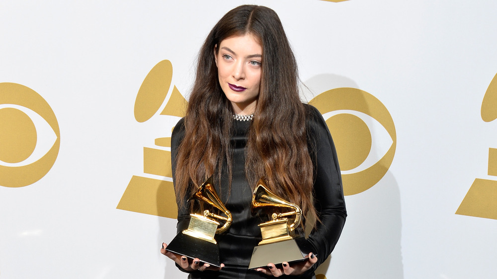 Lorde with Grammy Awards