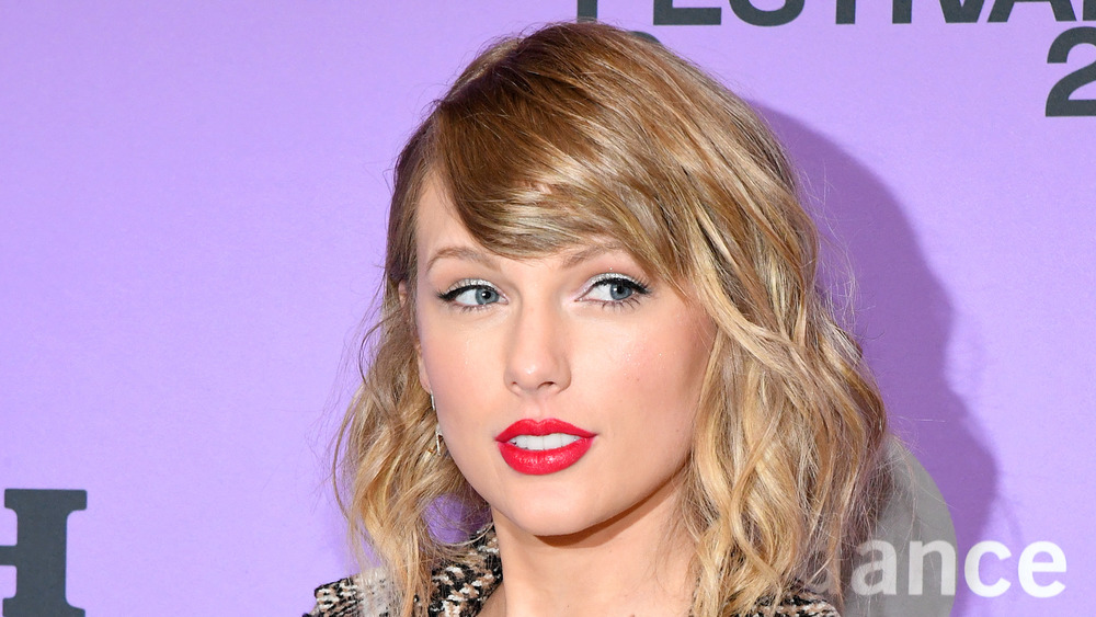 Taylor Swift wears red lipstick at an event