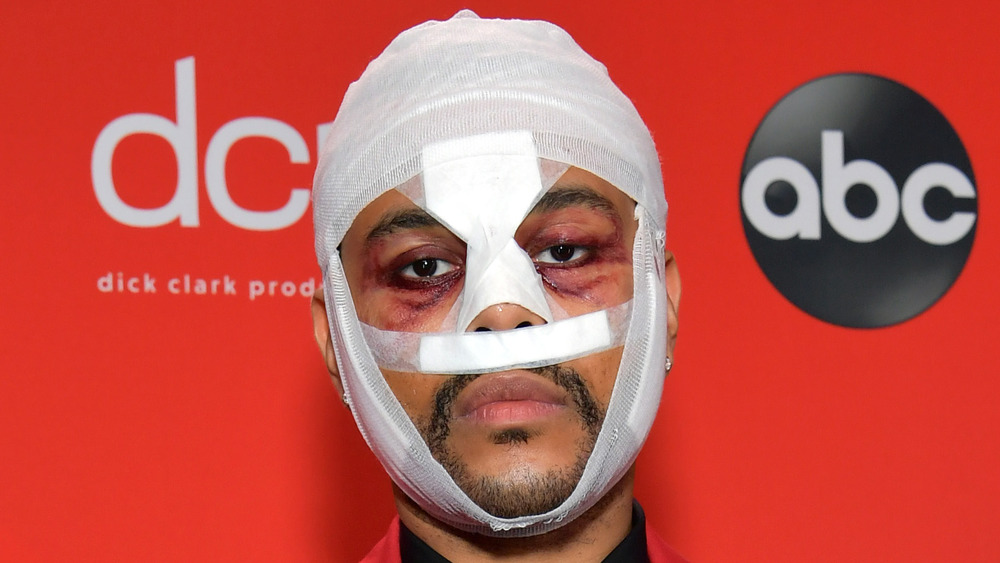 The Weeknd wearing face bandages