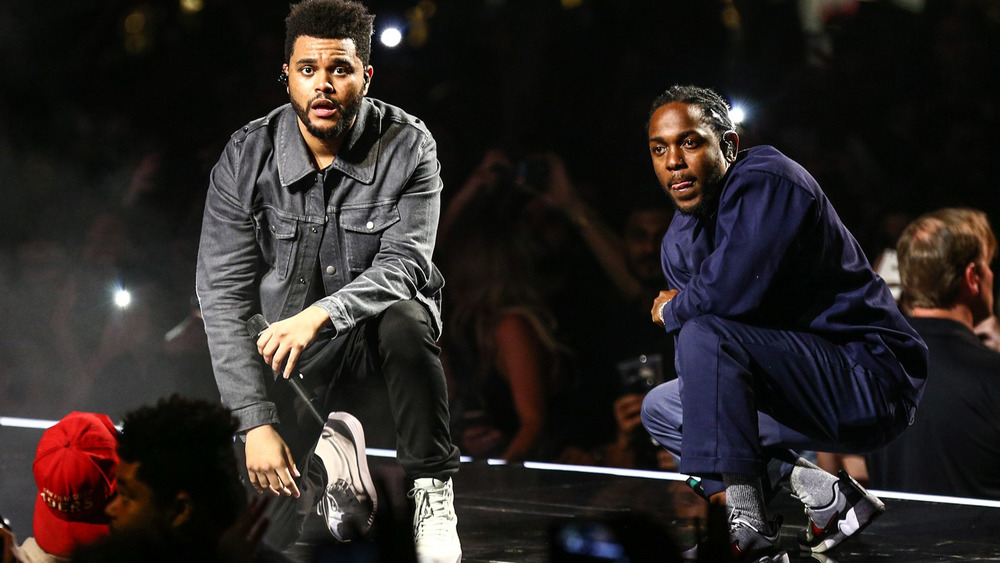 The Weeknd and Kendrick Lamar performing on-stage in 2017