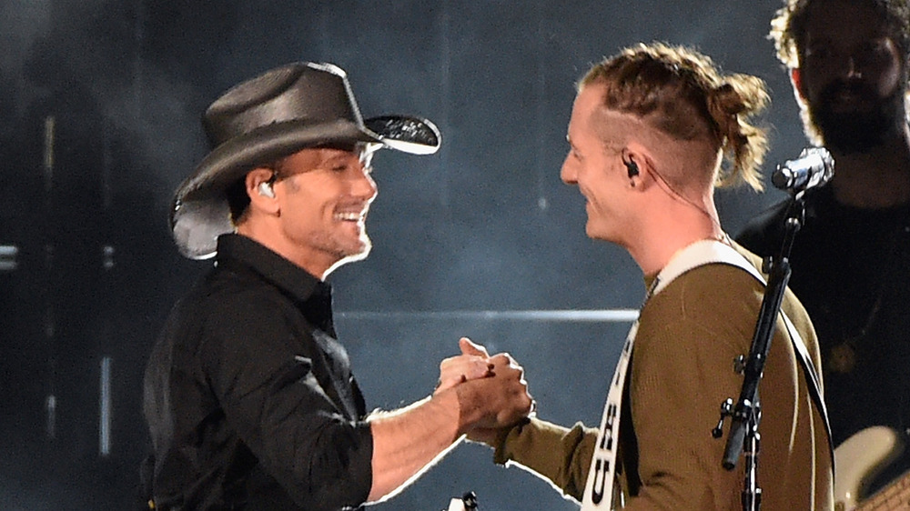 Tyler Hubbard and Tim McGraw perform onstage at the 2016 CMA awards