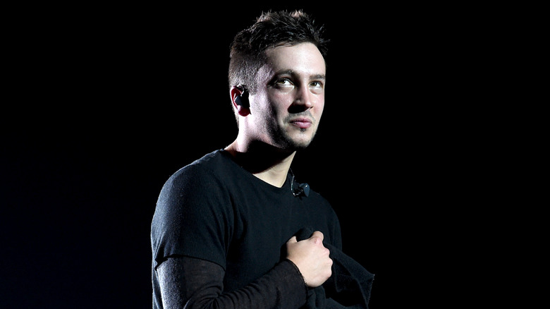 Tyler Joseph holding a mic