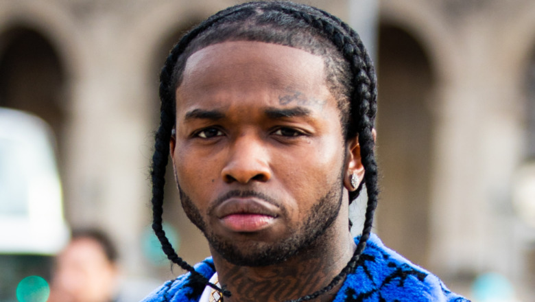 Rapper Pop Smoke, wearing a blue Off-White coat, is seen outside the Off-White show during the Paris Fashion Week - Menswear F/W 2020