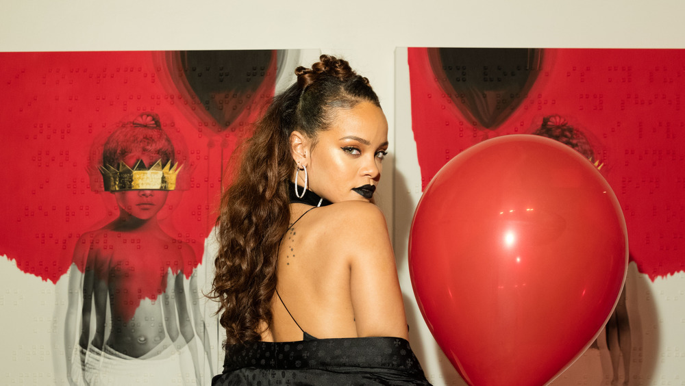 Rihanna with Anti posters