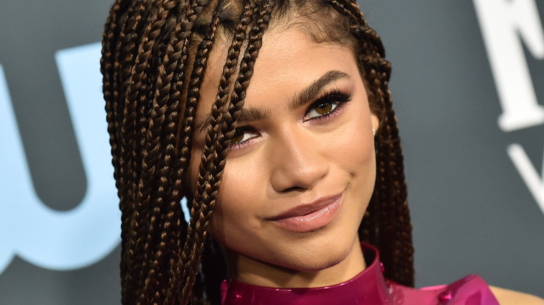 Zendaya wears a magenta dress on the red carpet