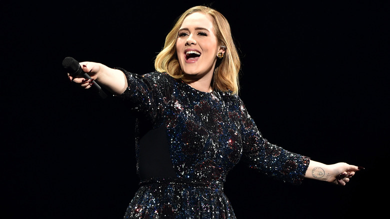 Adele smiling on stage