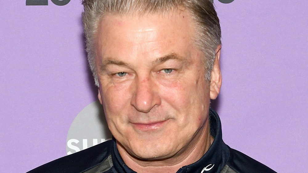 Alec Baldwin smiling on red carpet