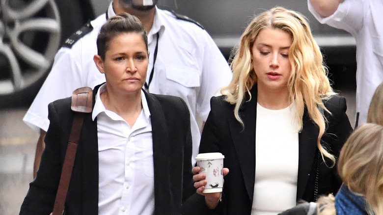 Amber Heard and Bianca Butti walking