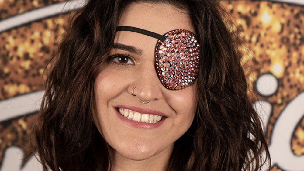 Andrea Valles wearing an eye patch